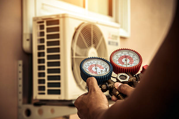 Professional Air Conditioning Service technician working in Warrensburg, NY